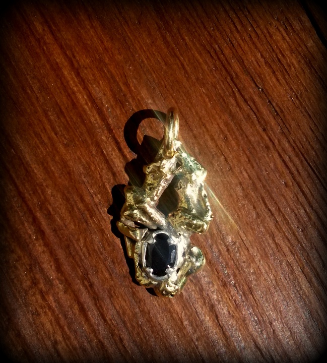 Pendant of silver and brass, with natural granate picture no. 2