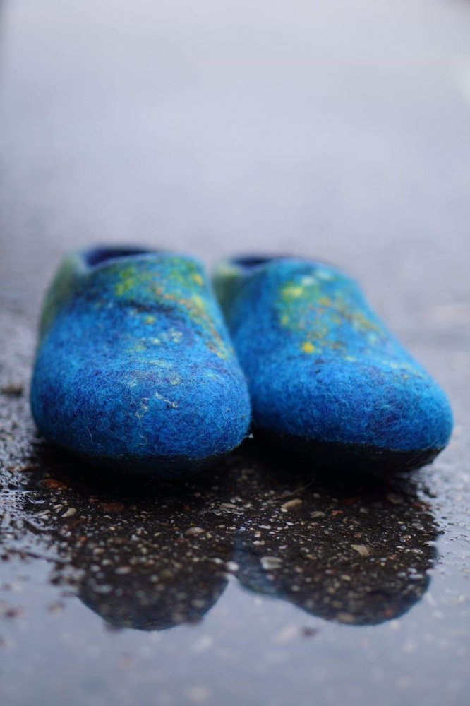 Blue felted slippers of womens