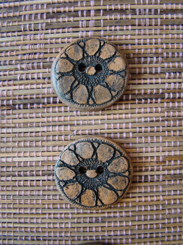 Aged clay buttons