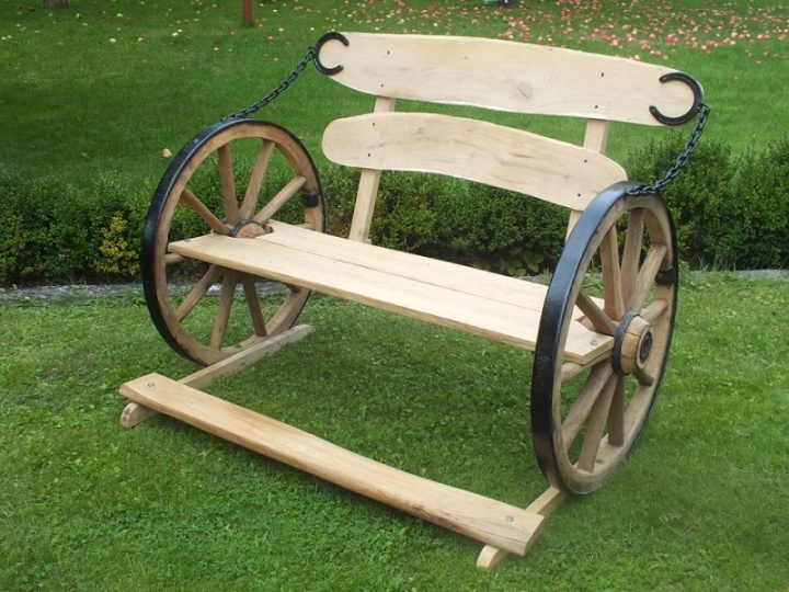Oak bench with a chariot wheel