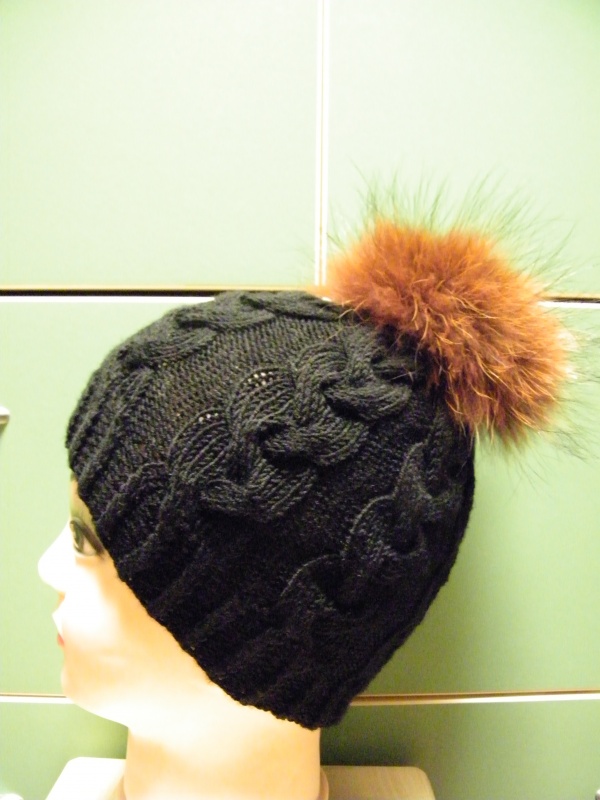 Black fox fur cap with pompons