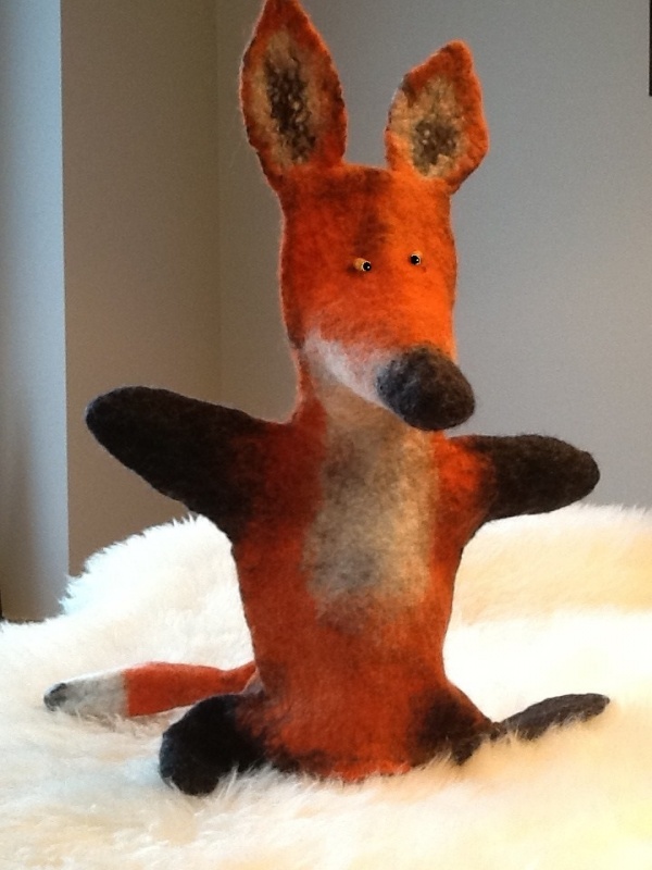 felting processes on the hand placed plaything pup