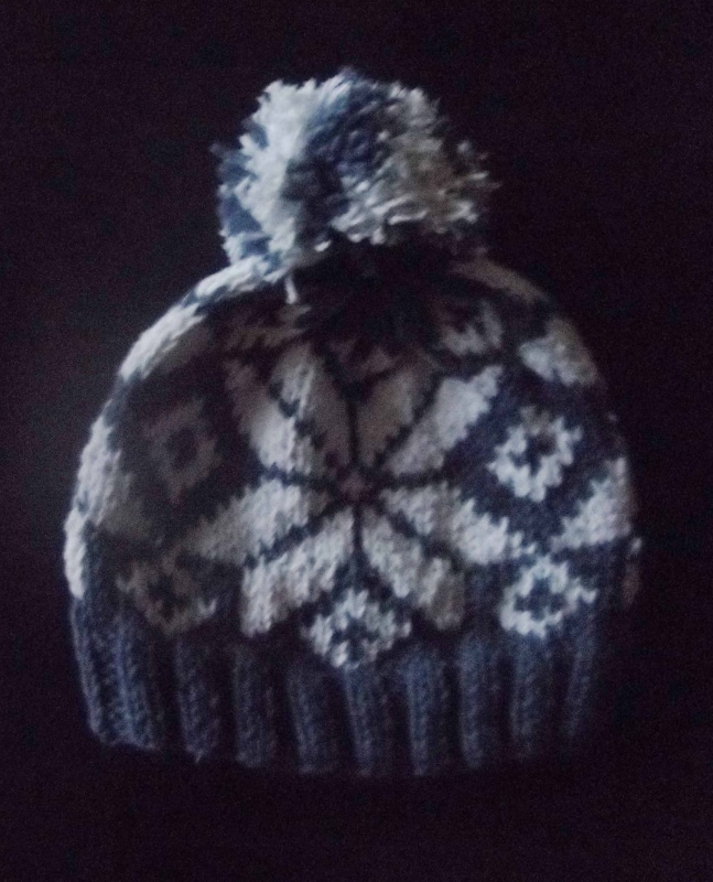 Hat with pompoms.