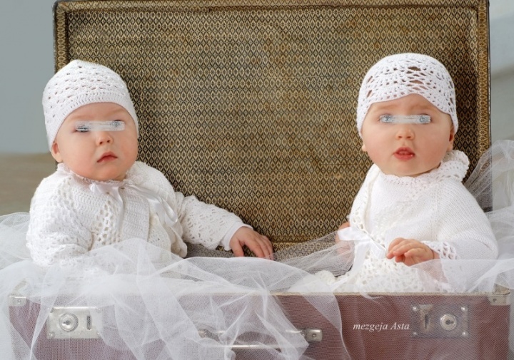 Crocheted christening clothes for two