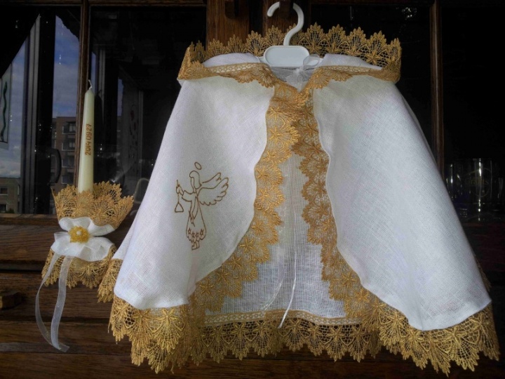 Baptismal cloak and candle