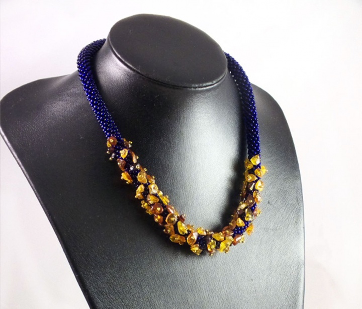 Blue bead crochet necklace with amber