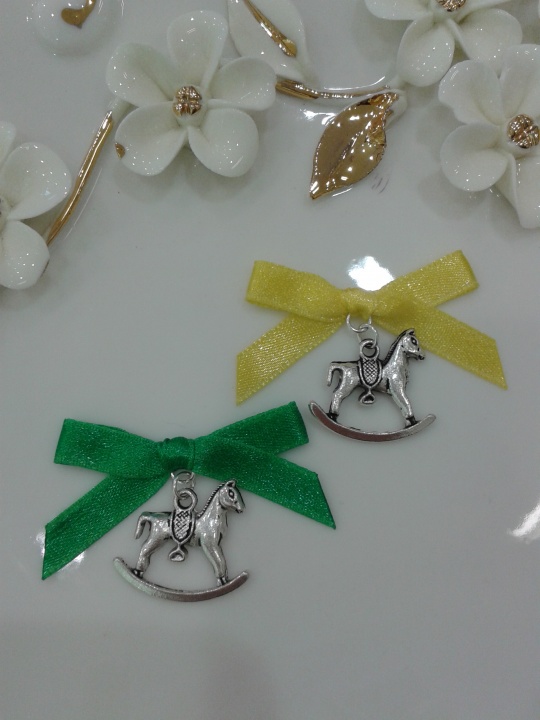 Pinned ribbons to horses