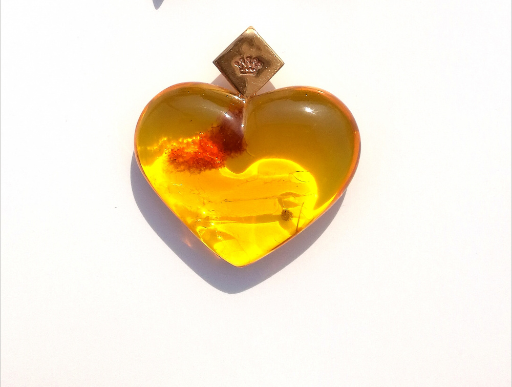 Necklace, Amber heart with brass