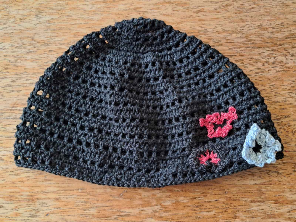 Black hat. Handmade crocheted hat for an adult