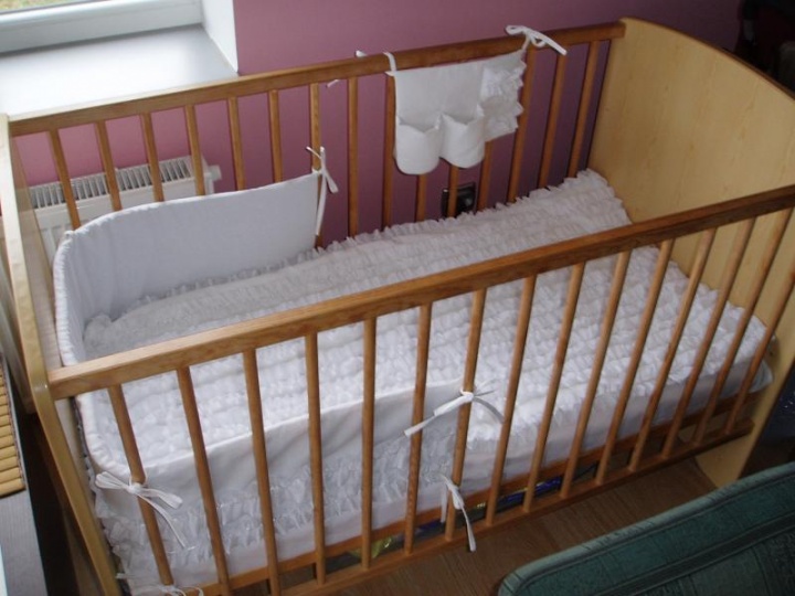 Decorated with ribbons - baby cot