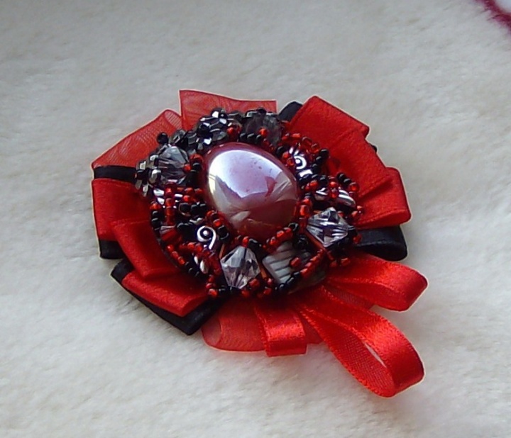 Ruby-colored brooch