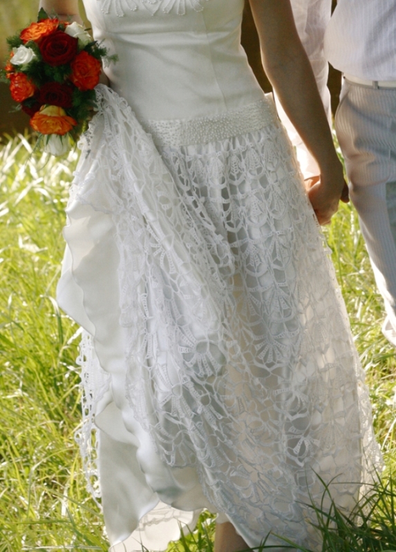 Wedding dress with crocheted bottom part