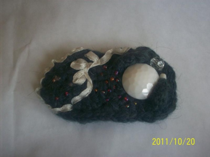 Grey brooch