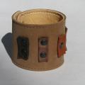 Brown bracelet with decoration. - Leather articles - making