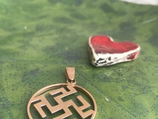 Feminine pendant with national motifs - Metal products