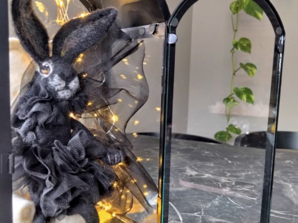 Souvenir Black Rabbit symbol of 2023, in vain by dry method.consists of: rabbit, chair, light bulbs, metal lantern.the rabbit is dressed in tulle   - For interior